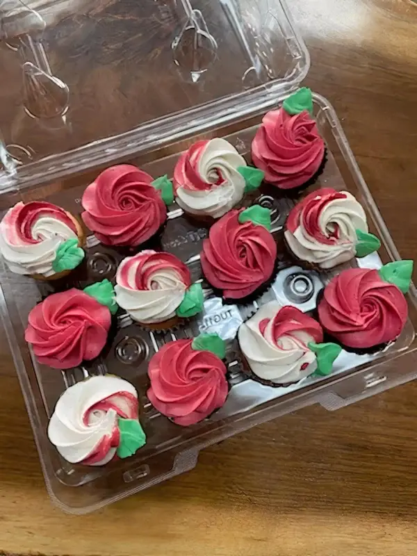 12ct Rose cupcakes decorated with 2 rose designs. Half chocolate, half vanilla